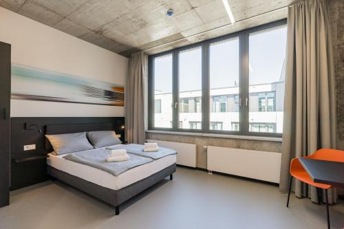 Ένα ή περισσότερα κρεβάτια σε δωμάτιο στο Nena Apartments Moritzplatz