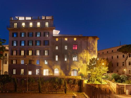 a building with a red window in front of it at Rhinoceros in Rome