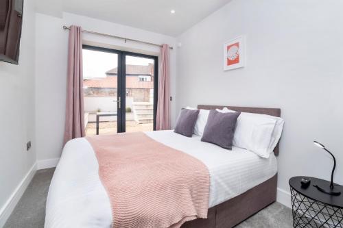 a bedroom with a large bed and a window at The Old Hotel in York