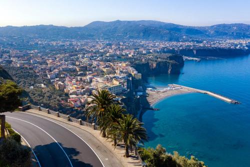 a view of the amalfi coast and a road at Alimuri Bay Resort in Meta