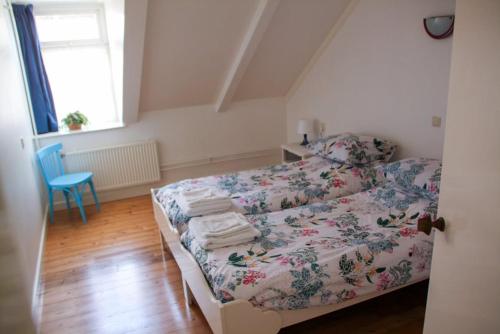 a bedroom with a bed with towels on it at hotel 't Doktershus in Lemmer