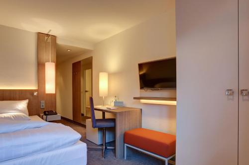 Ένα ή περισσότερα κρεβάτια σε δωμάτιο στο Kommerzhotel Köln