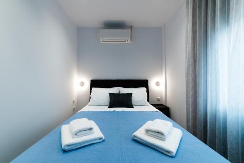 Postel nebo postele na pokoji v ubytování Athena Center Apartments