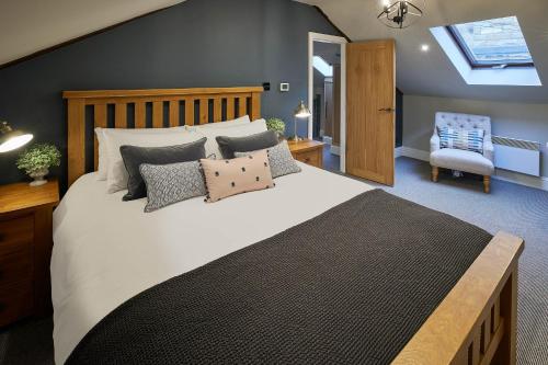 a bedroom with a large bed and a chair at Host & Stay - The Green Door in Richmond