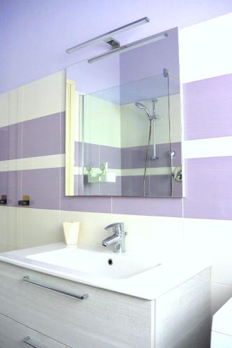 a bathroom with a sink and a mirror at Dianostellamarina in Diano Marina