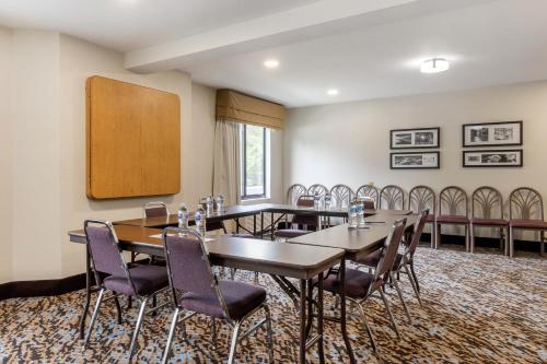a boardroom with tables and chairs in a room at Sleep Inn & Suites in Johnson City