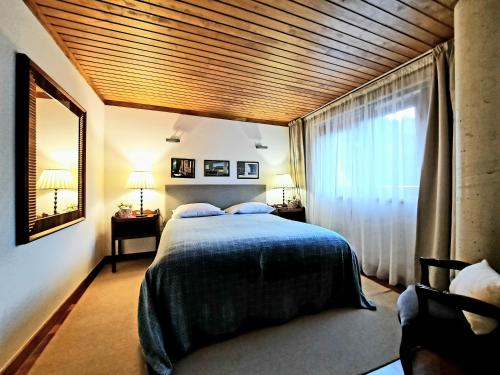 Кровать или кровати в номере Casa do Penedo - Quinta de Fundevilla