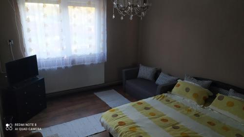 Postel nebo postele na pokoji v ubytování Abacskó Ház