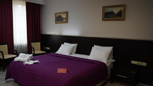 Postel nebo postele na pokoji v ubytování Arsan Otel