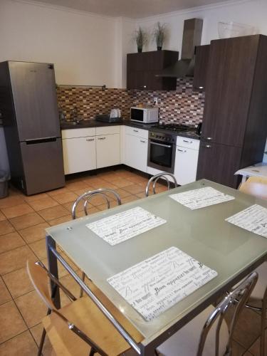 a kitchen with a table with drawings on it at Halex 3 in Bojná
