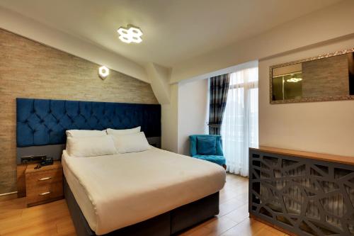Postel nebo postele na pokoji v ubytování Grande Stella Hotel