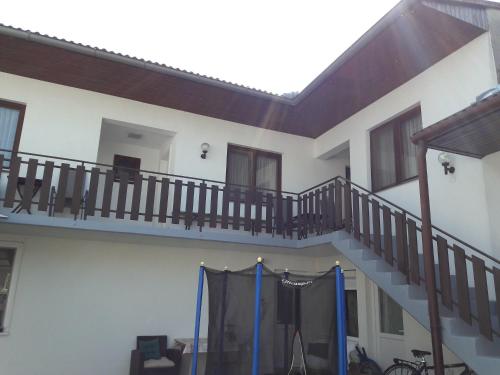 a house with a staircase in the middle at Ferienwohnung Schwarzbauer in Illmitz