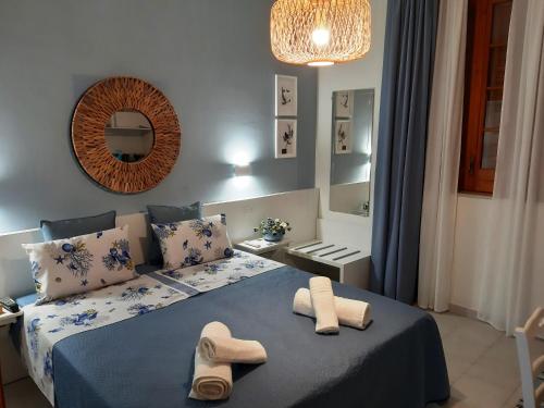 Ліжко або ліжка в номері La Villa di Eracle