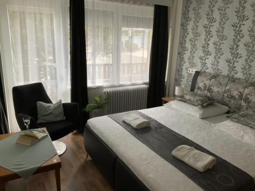 Posteľ alebo postele v izbe v ubytovaní Oleander Apartman