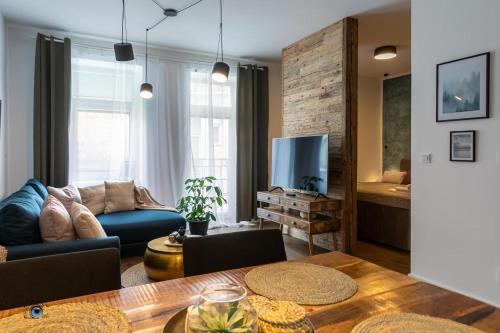 a living room with a couch and a table at Sting Old Town Ostrava in Ostrava