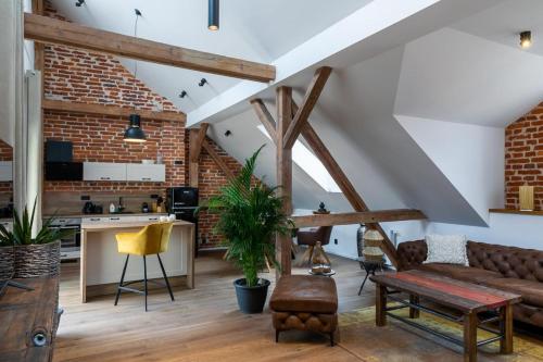 a living room with a couch and a table at Sting Old Town Ostrava in Ostrava