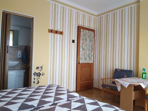 Postel nebo postele na pokoji v ubytování Martha Apartman