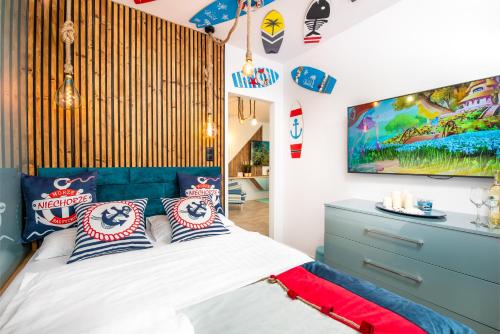 Ένα ή περισσότερα κρεβάτια σε δωμάτιο στο Baltic Cliff Apartamenty