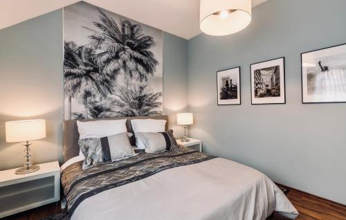 Posteľ alebo postele v izbe v ubytovaní Monarchia Apartman Grand