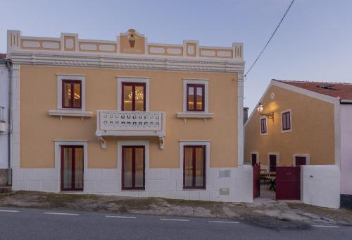 a building with a sign on the front of it at Casa das Margaridas in Vale de Lobo