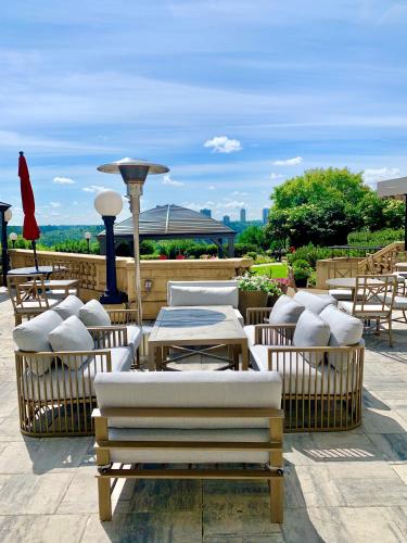 a patio with tables and chairs and a table and chairs at Fairmont Hotel Macdonald in Edmonton