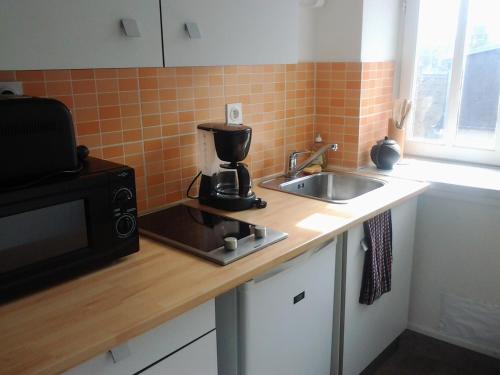 Køkken eller tekøkken på Appartement Rue Georges V - Port de la Houle