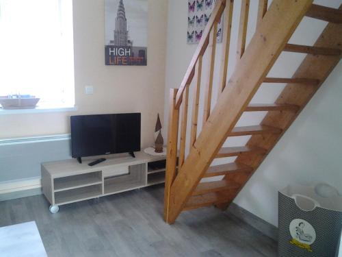 Et tv og/eller underholdning på Appartement Rue Georges V - Port de la Houle