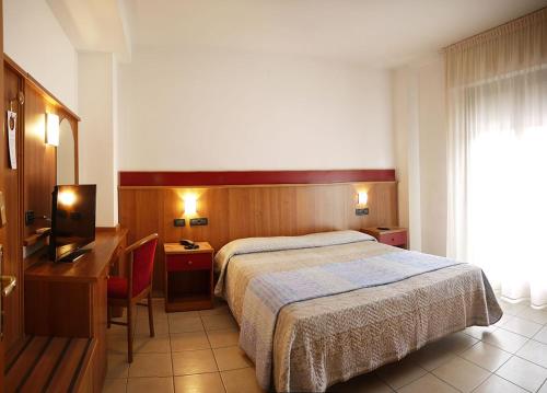 Ένα ή περισσότερα κρεβάτια σε δωμάτιο στο Residence Alla Rotonda
