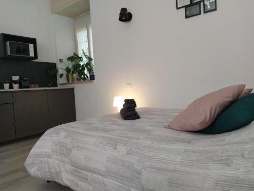 a bedroom with a large bed with a stuffed animal on it at La Casa di Oreno in Vimercate