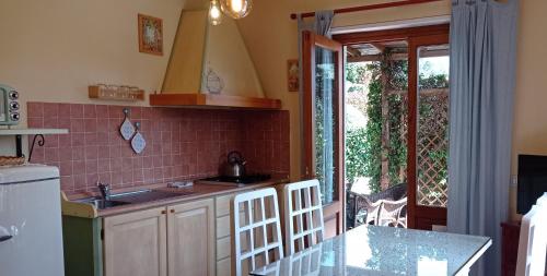 a kitchen with a sink and a counter top at Agriturismo Tenuta La Fratta in Bagni di Lucca