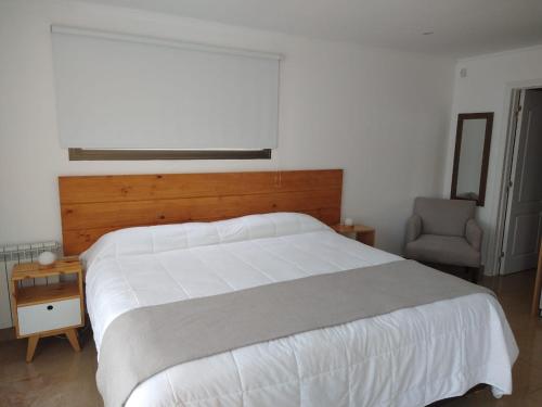 Un pat sau paturi într-o cameră la Chacras de Sierra