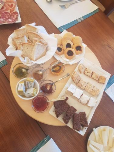 a plate with different types of food on a table at Agriturismo Fattoria didattica Il Macereto in Fivizzano