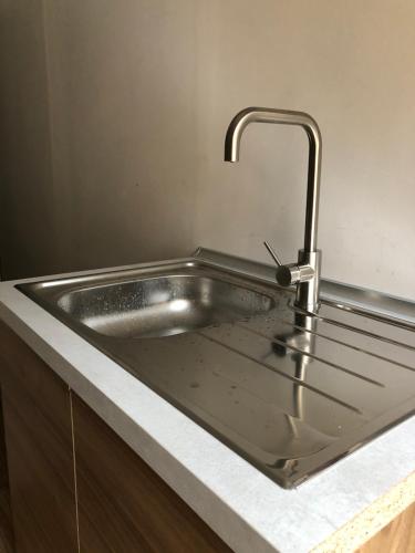 a stainless steel sink with a faucet in a kitchen at B&B Degli Artisti in Lecce