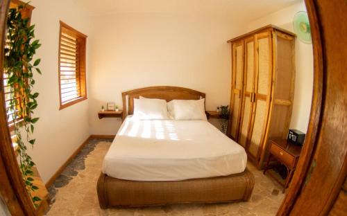 Postel nebo postele na pokoji v ubytování El jardín del coco, apartamento 14 - near La Playita beach
