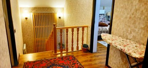 a hallway with a stairway leading to a room at Dom Semya Deluxe Gusar in Qusar