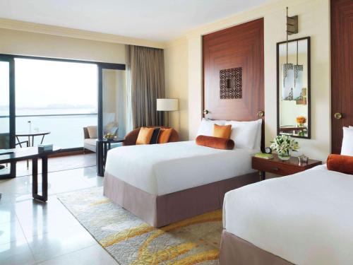 Un ou plusieurs lits dans un hébergement de l'établissement Fairmont The Palm