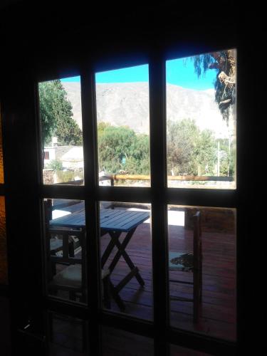 a view of a table from a window at Hosteria La Estacion in Tilcara