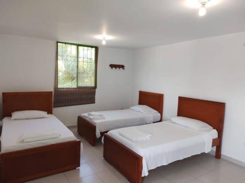 Postel nebo postele na pokoji v ubytování Hotel El Don
