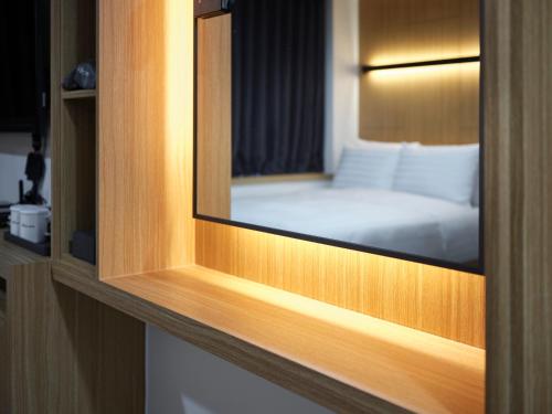 a view of a bedroom with a bed in a room at S Stay Hotel in Suwon