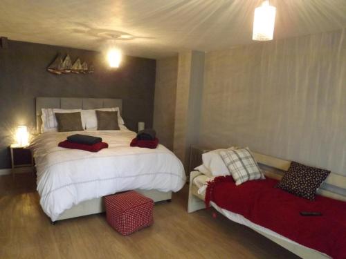 a bedroom with two beds in a room at The Swallows Guest House in New Quay
