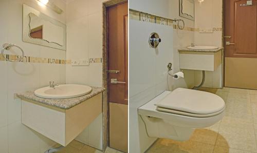 a bathroom with a toilet and a sink at Treebo Savoury Sea Shell Residency in Bengaluru