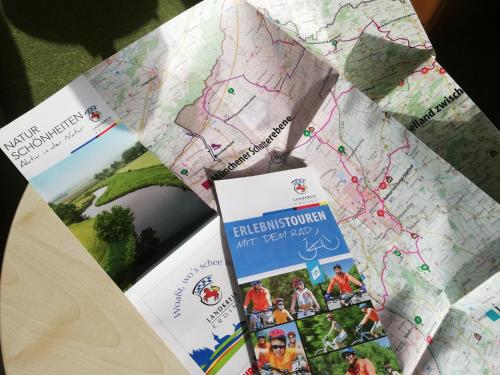 a close up of a map and some cards at Hotel Nummerhof in Erding
