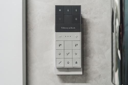 a clock on a wall with a whitenesday alarm on it at Apartament SPA Lublin Centrum in Lublin