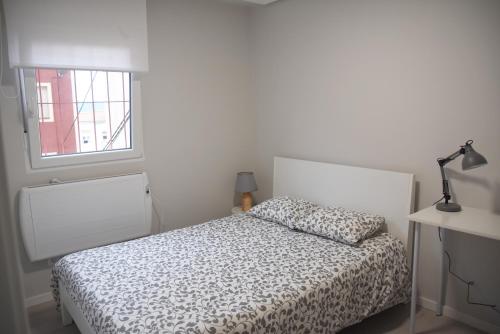 A bed or beds in a room at Apartamento en Pleno Centro Recien Reformado