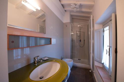 a bathroom with a sink and a shower at LA RIMESSA EXPERIENCE-Dream Holiday Home in Montaione