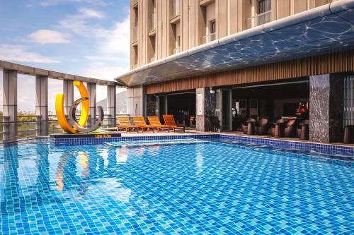 a large swimming pool on top of a building at Malibu Hotel in Vung Tau
