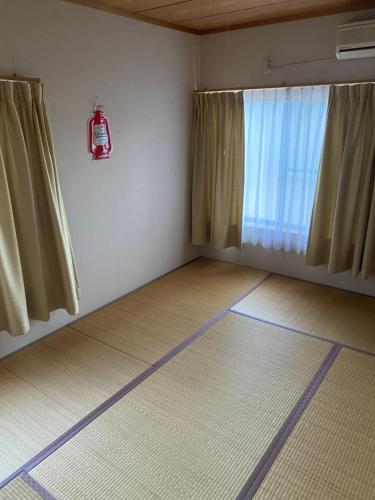 Postel nebo postele na pokoji v ubytování 花緑里-Hanamidori-乙原のやど 岐阜下呂温泉郡上飛騨金山湖畔リゾート