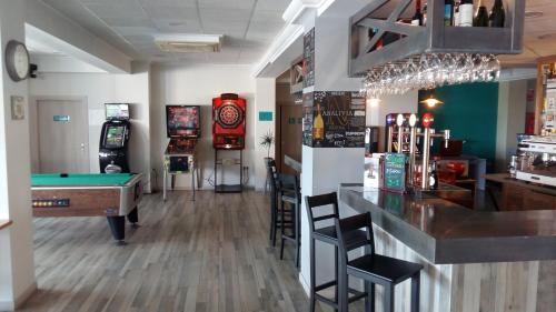 a bar with a pool table and a bill at Te Maná Hotel in Torreblanca