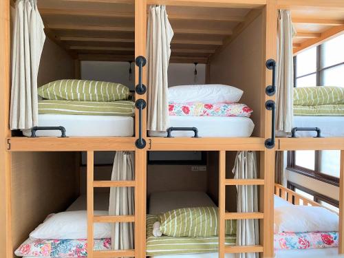 Postel nebo postele na pokoji v ubytování FunNan Guesthouse