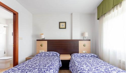 Llit o llits en una habitació de Hotel Canaima Bruma 1,5 k Camino